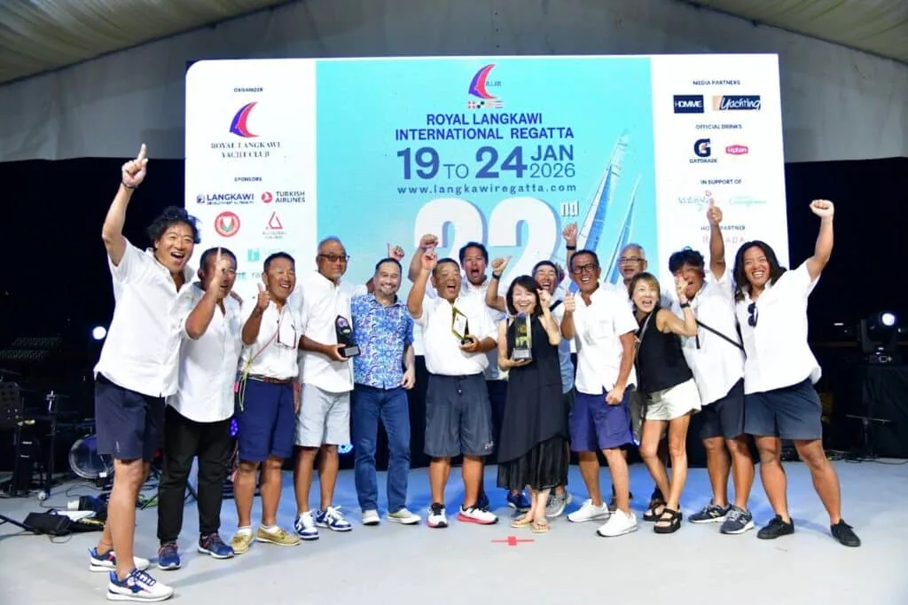 Prize-giving crowd on stage under the Royal Langkawi International Regatta banner
