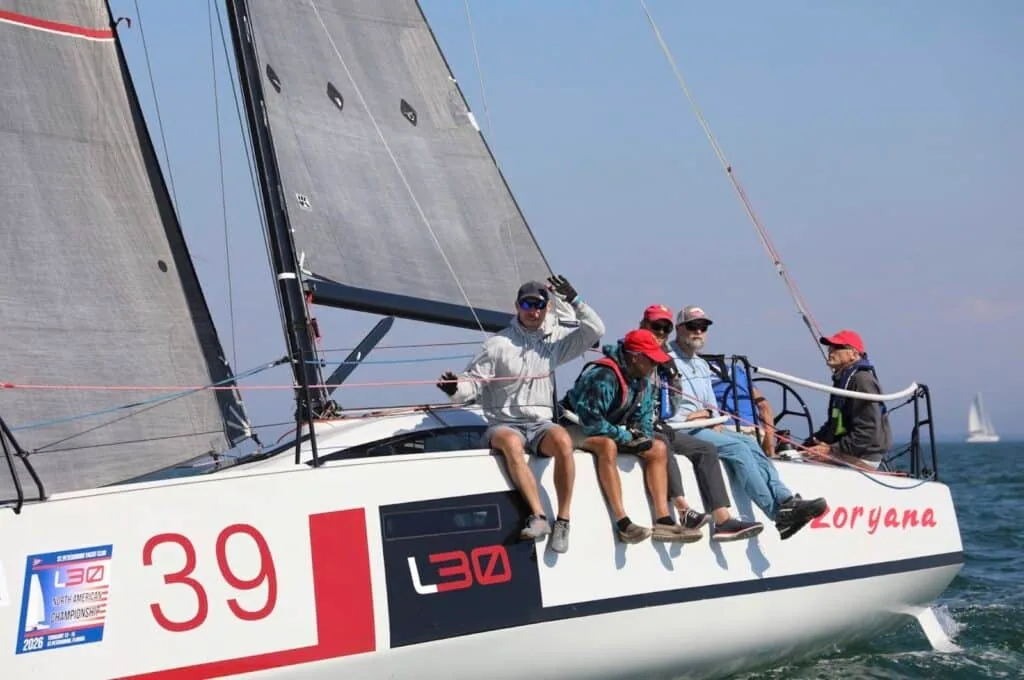 Zoryana, L30 #39, sailing close-hauled with crew on the rail