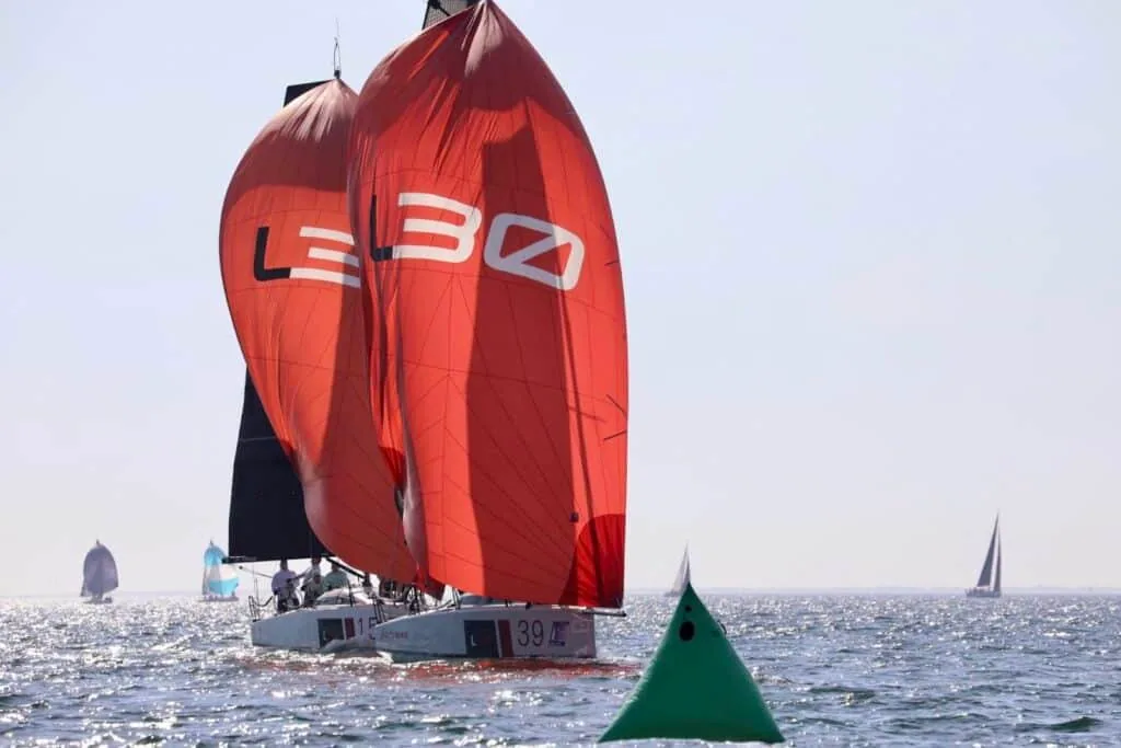 L30 #39 rounding a green mark under a red L30-branded spinnaker