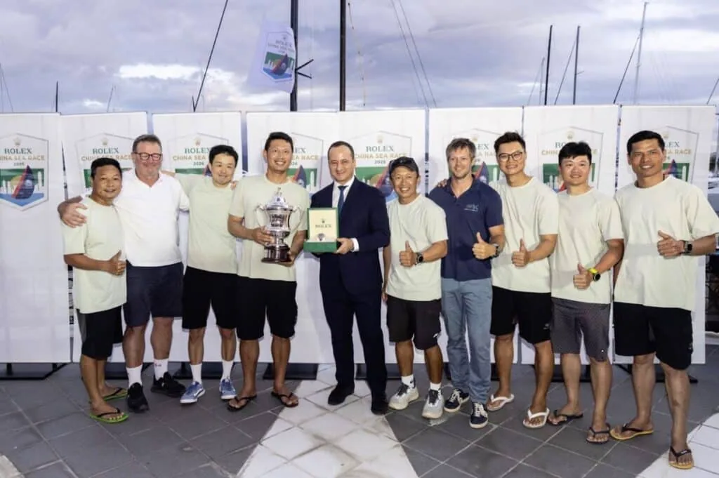 Winning crew posing with the trophy at the prize-giving