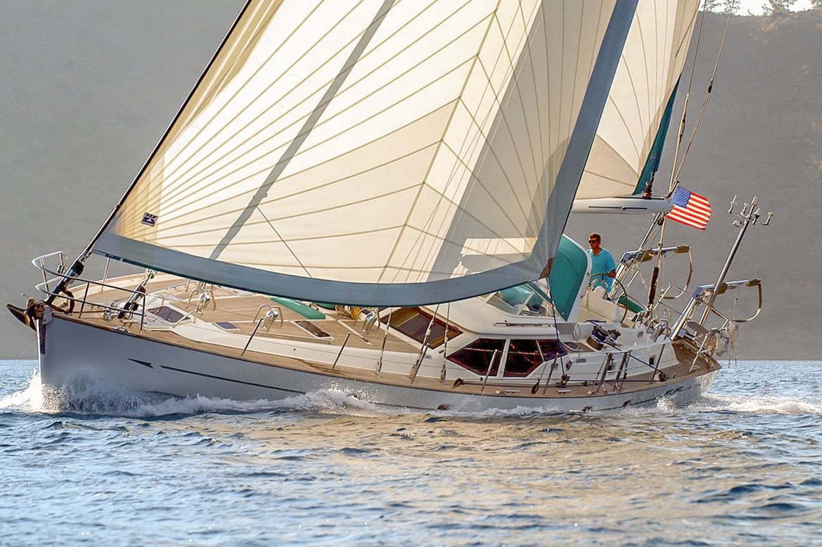 Classic yacht sailing under a tri-radial hybrid woven headsail and mainsail
