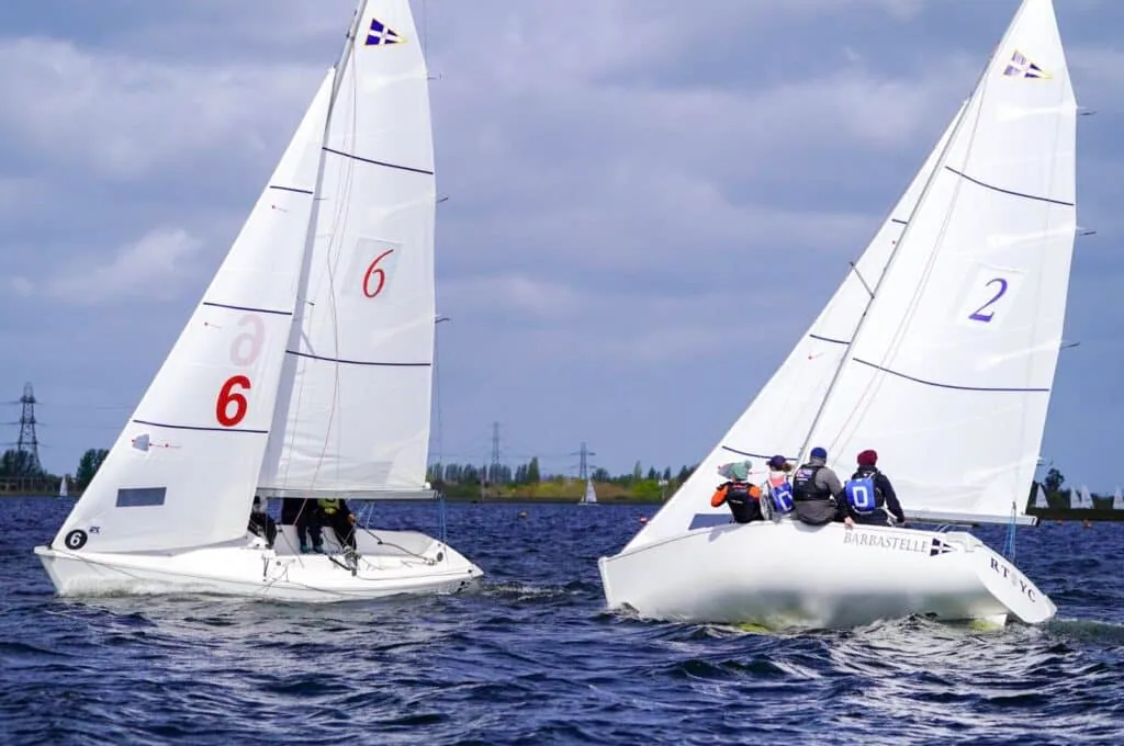 Sail numbers 6 and 2 duel upwind at the 2026 Carmela Cup