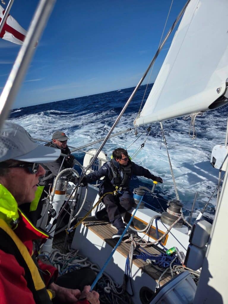 Blue Skies' crew holds on as she powers through rough offshore seas