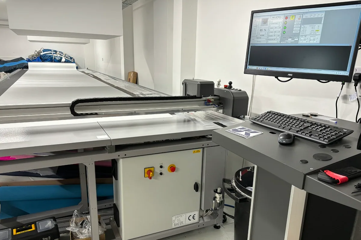 A digital cutting table and computer plot sail panels in the loft