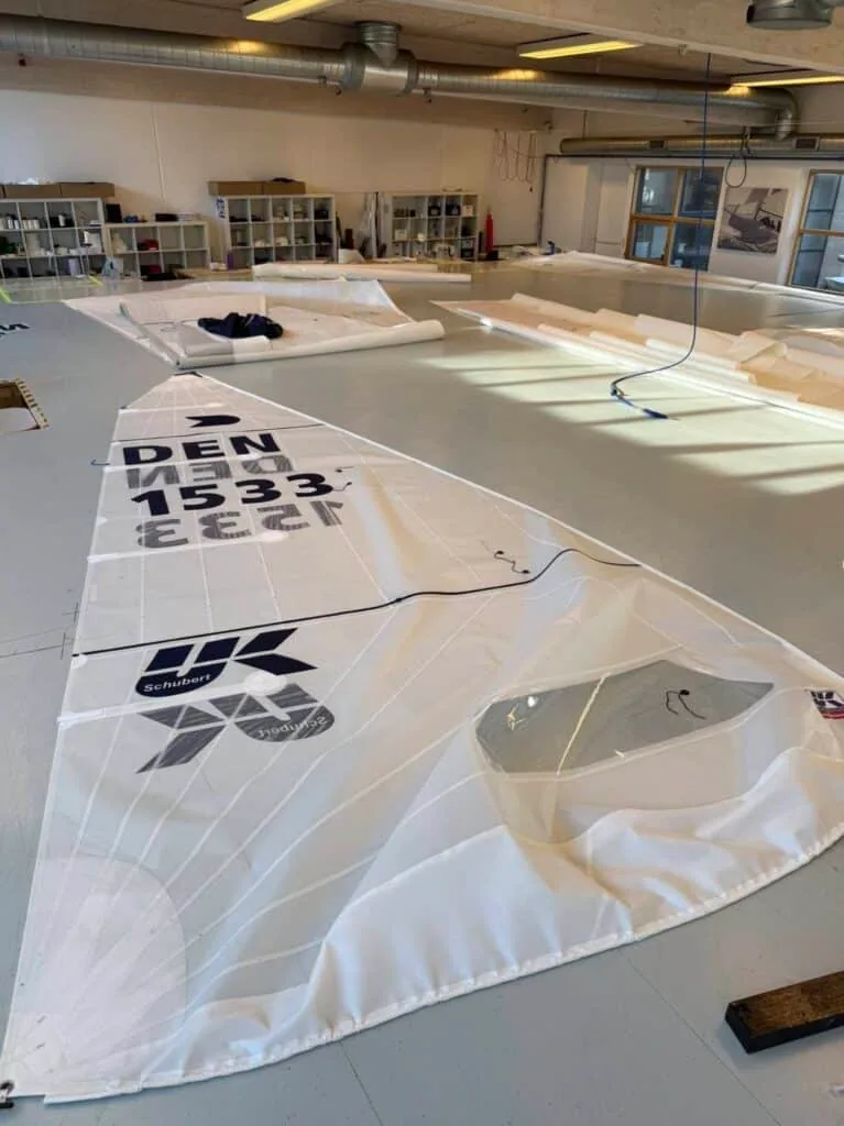 OK Dinghy sail marked DEN 1533 and Schubert laid out on the loft floor