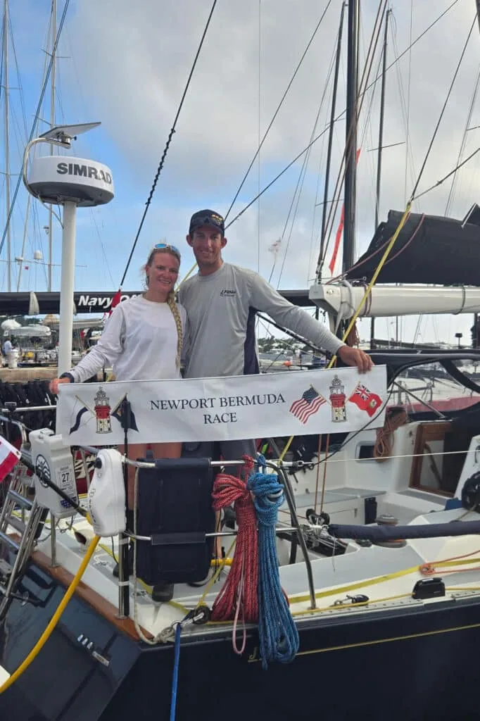 Kenai's crew poses dockside with the Newport Bermuda Race finish banner