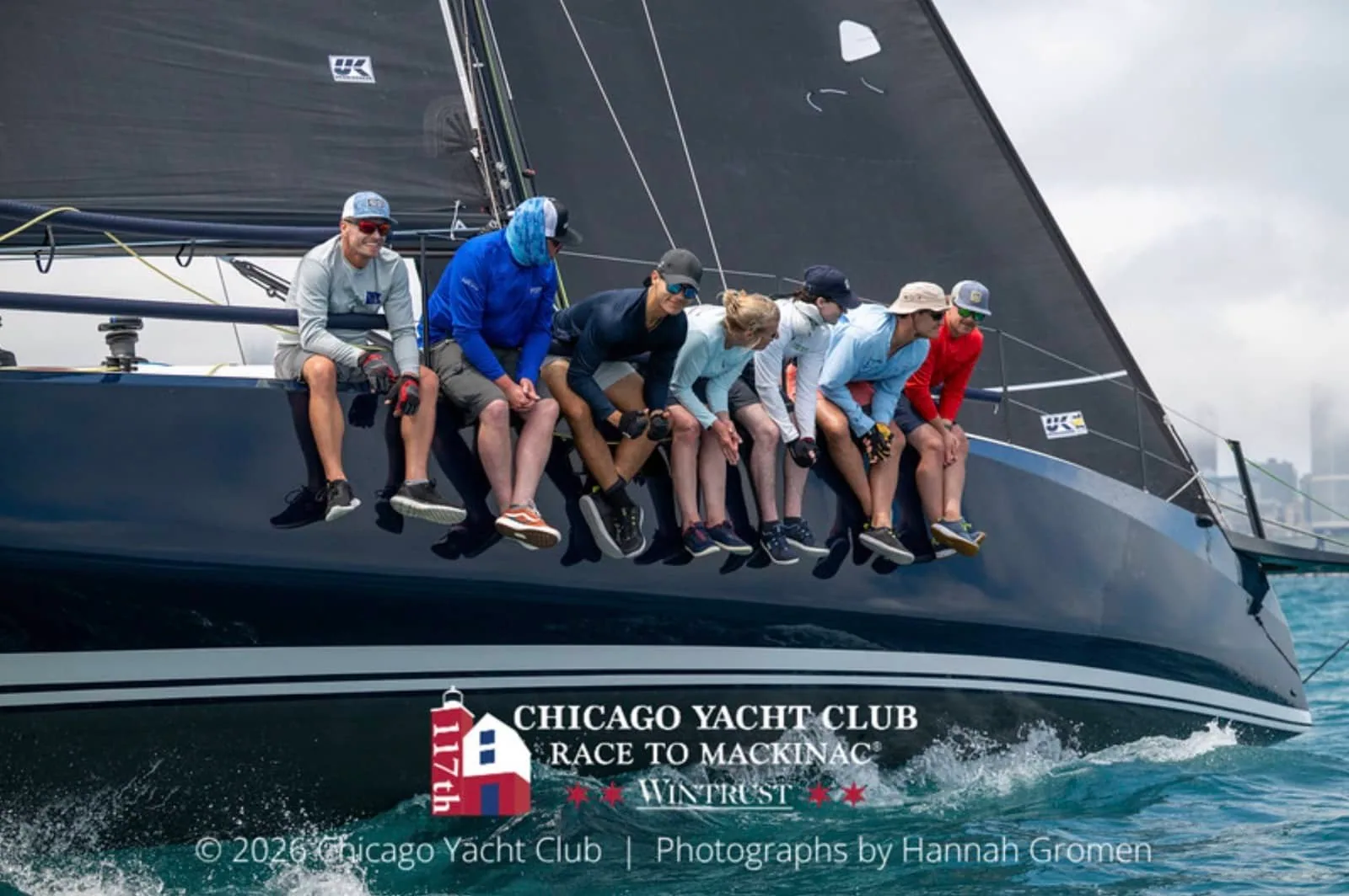 Eagles Wings' crew hikes out under a dark mainsail at the Mackinac start