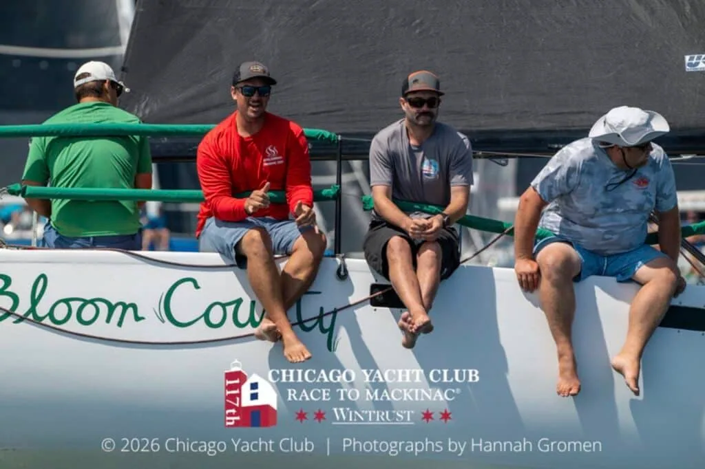 Bloom County's crew relaxes on the rail before the Mackinac start