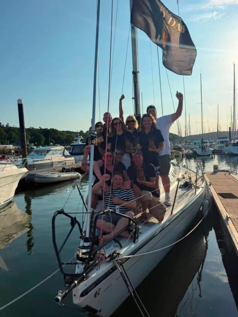 Left: Big Mac during their pre-regatta shakedown sail. Right: The Big Mac crew celebrate their success at this year’s Cork Week. Photo © Ella Fray.