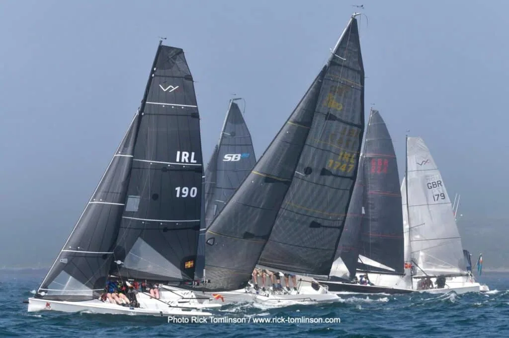 IRL 190 and GBR 179 race close together upwind in a tight fleet