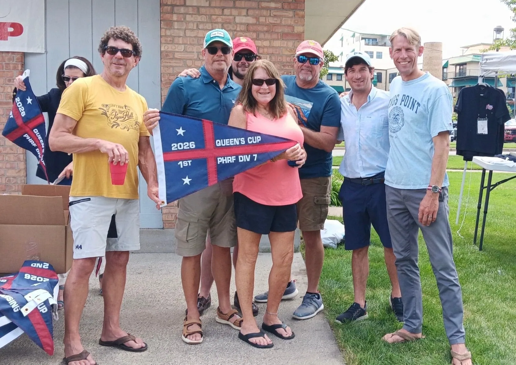 Condor and Sirocco crews pose with their 2026 Queen's Cup PHRF Div 7 burgee