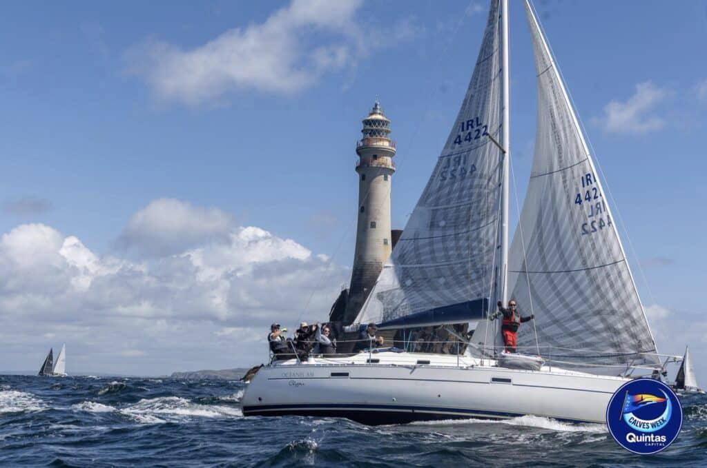 IRL 4422 sails past the Fastnet Rock lighthouse at Calves Week
