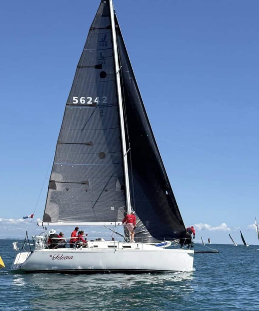 J/109 Feleena, sail number 56242, sailing under dark UK Sailmakers main and jib with crew in red