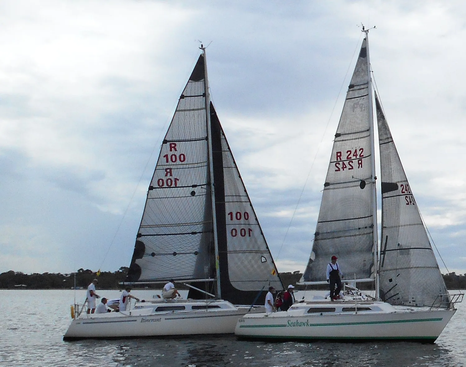 Farr 9.2s ITINERANT (R100) and SEAHAWK (R242) sailing side by side under dark laminate mainsails