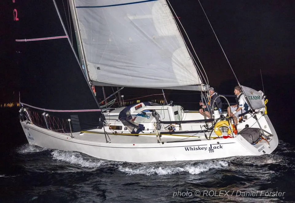 J/109 WHISKEY JACK floodlit at night crossing the China Sea Race finish in Subic Bay