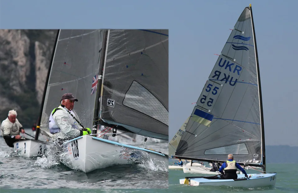 Two Finn dinghies racing: a veteran sailor hiking hard upwind and UKR 55 ghosting along under a grey sail