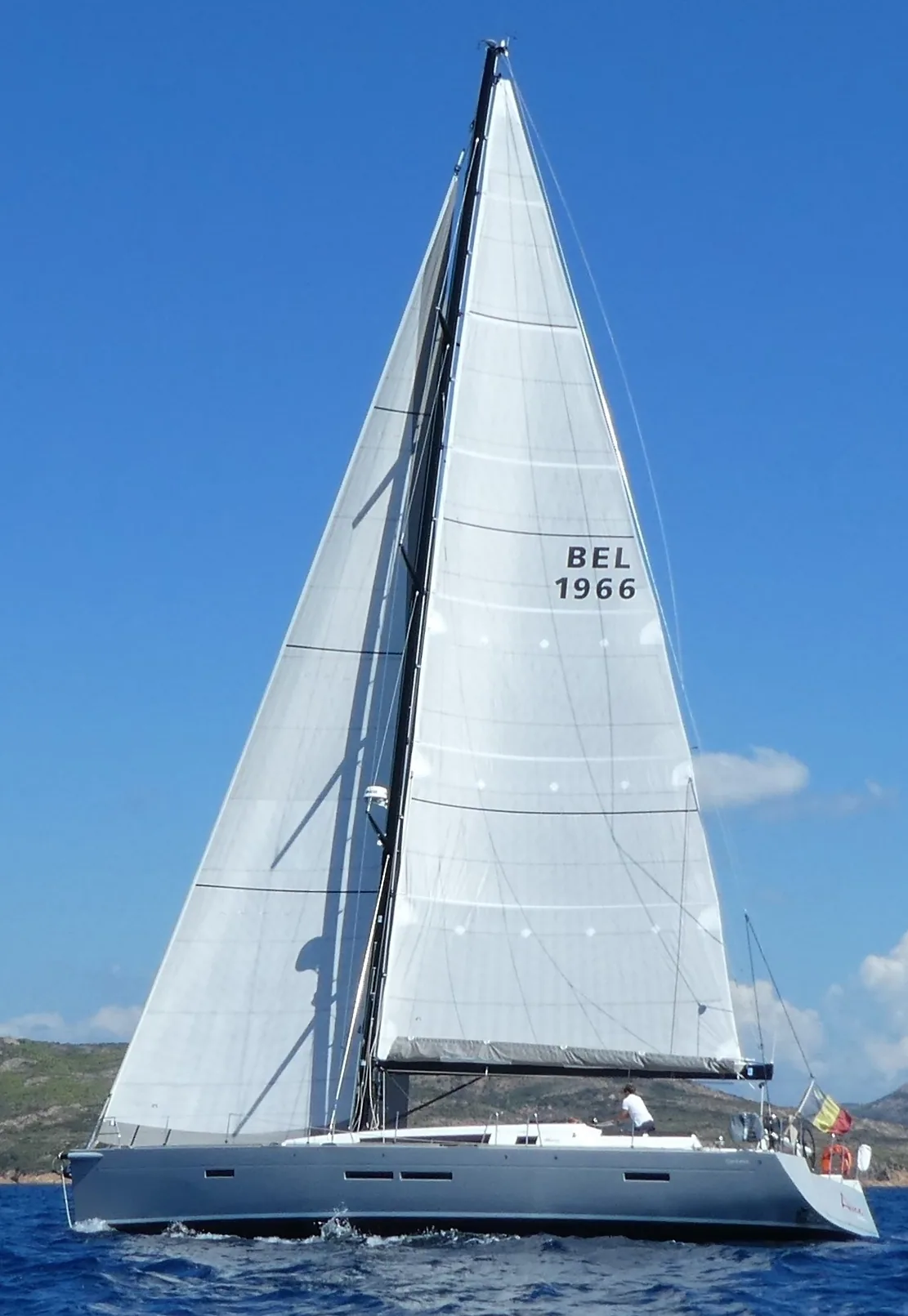 Centurion 57 with dark grey hull sailing upwind under light grey laminate main and genoa, sail number BEL 1966