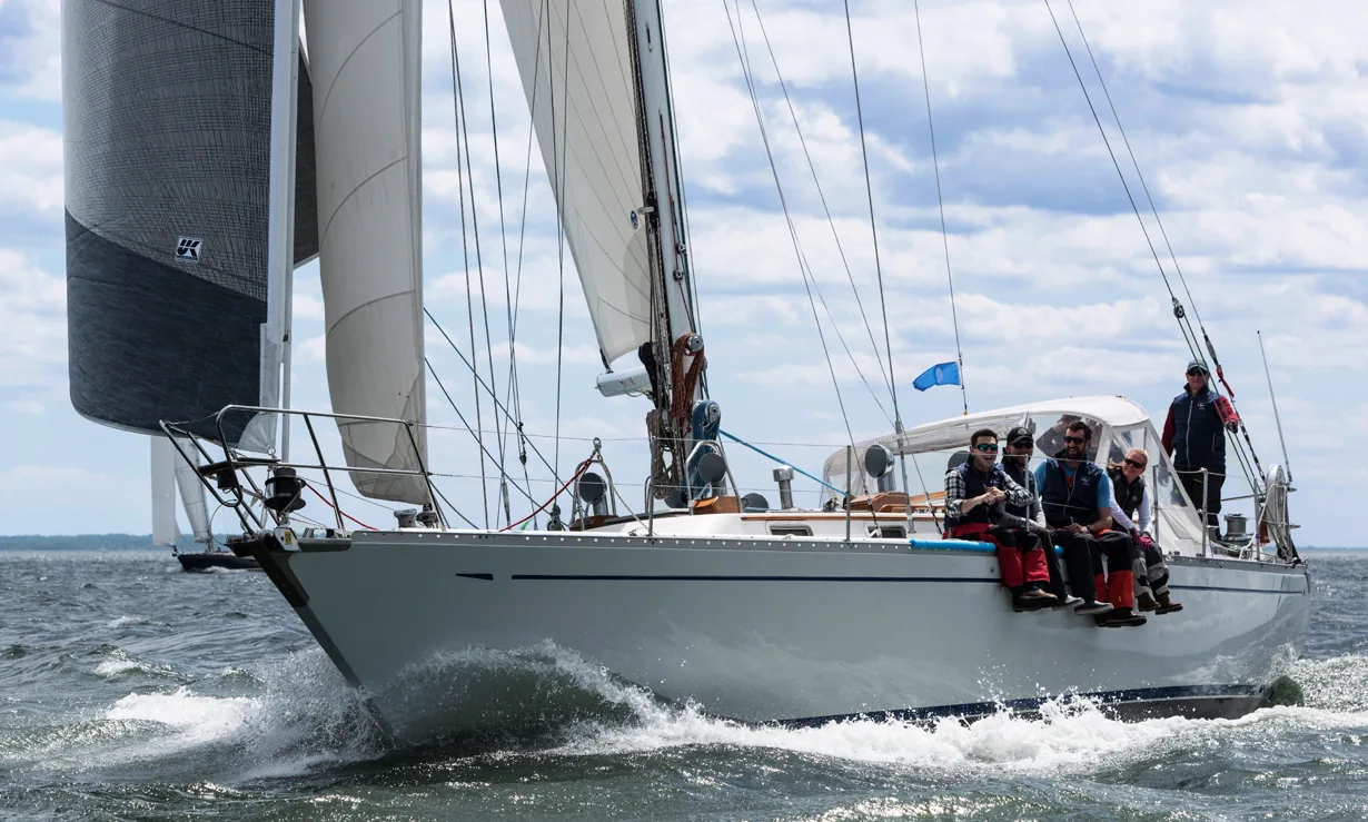 Alden 50 ELENA driving upwind under grey X-Drive® genoa with crew on the rail and a bow wave flying