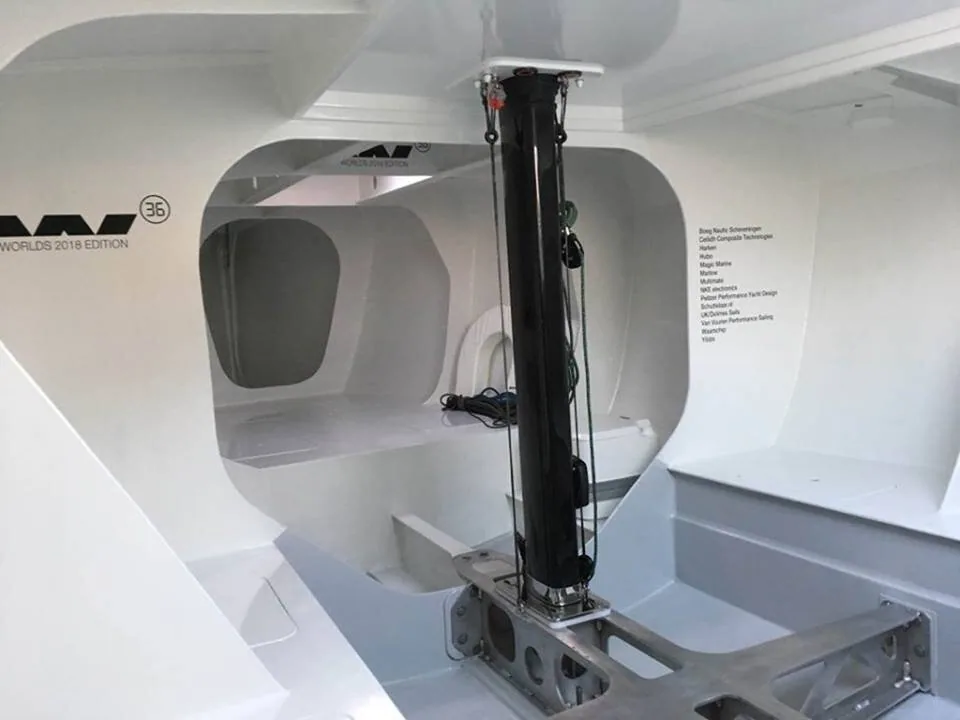 Stripped-out white composite interior of the Waarschip 36 HUBO with a black carbon post and Worlds 2018 Edition lettering
