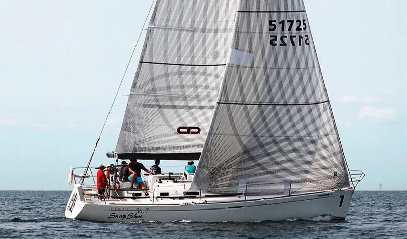 Beneteau 36.7 SNAPSHOT sailing upwind under silver-grey laminate main and genoa, sail number 51725, crew of five