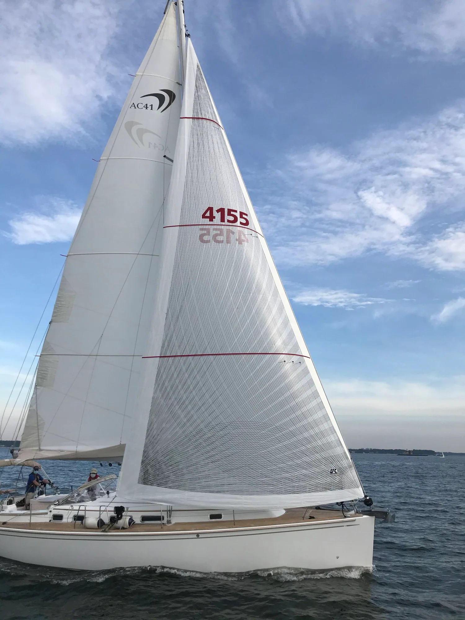 X-Drive® main and genoa on a sloop, sail number 4155, red draft stripes and fibre tapes catching the light
