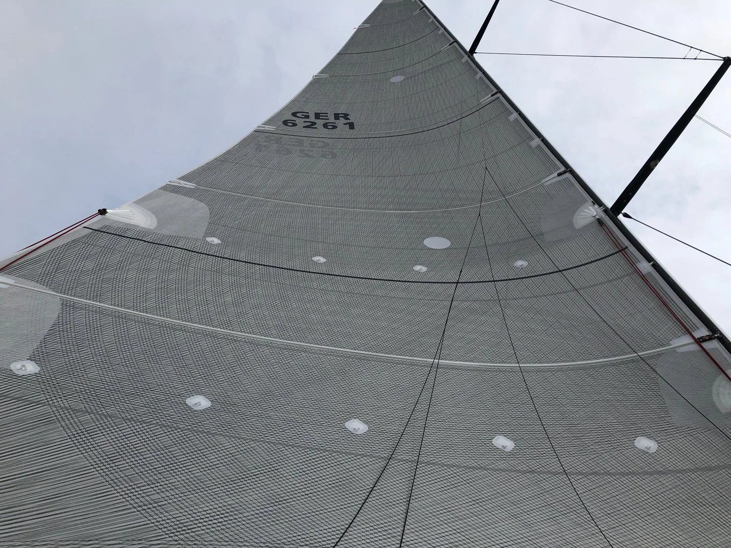Looking up a Swan 60 X-Drive® Carbon mainsail, GER 6261, showing its carbon tape load paths and battens
