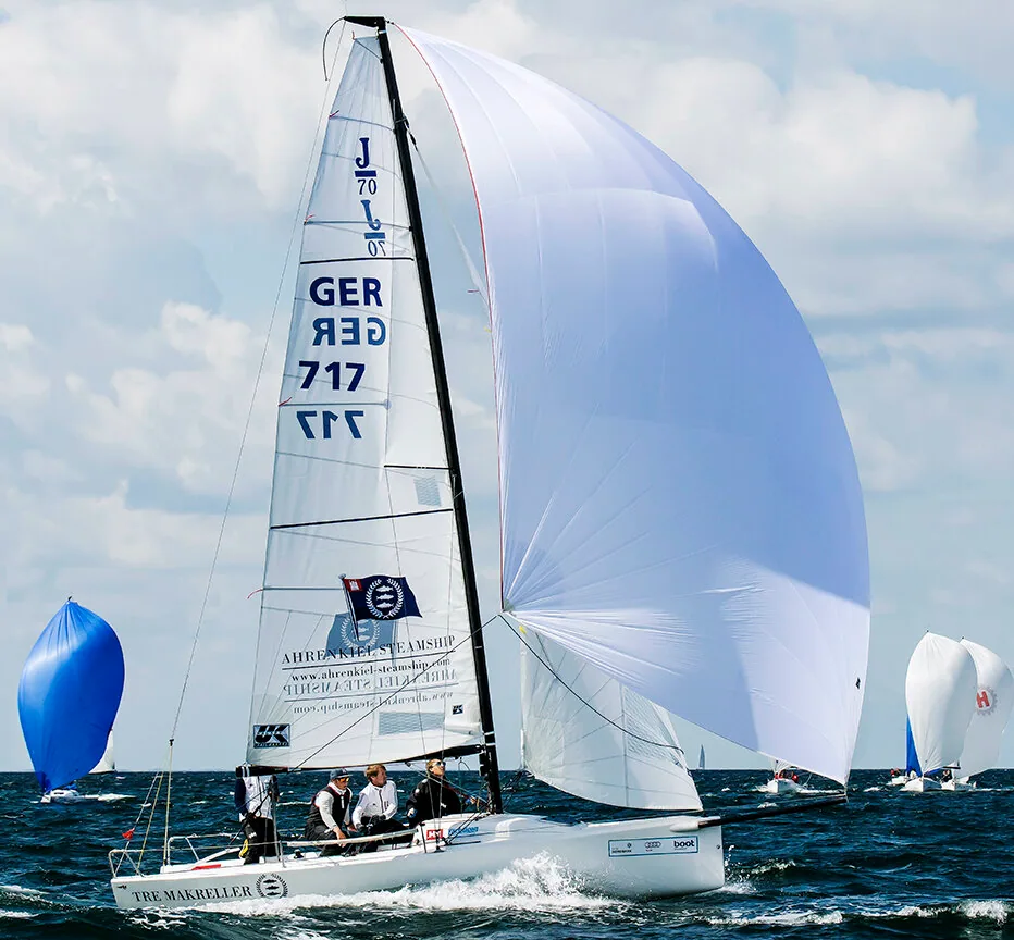 J/70 GER 717 at Kiel Week 2015 flying a white asymmetric spinnaker, white mainsail with J/70 insignia, spinnakers around