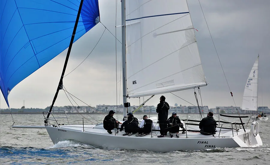 Ken Horne's J/105 Final Final running under a blue spinnaker with six crew aboard at Charleston Race Week 2021